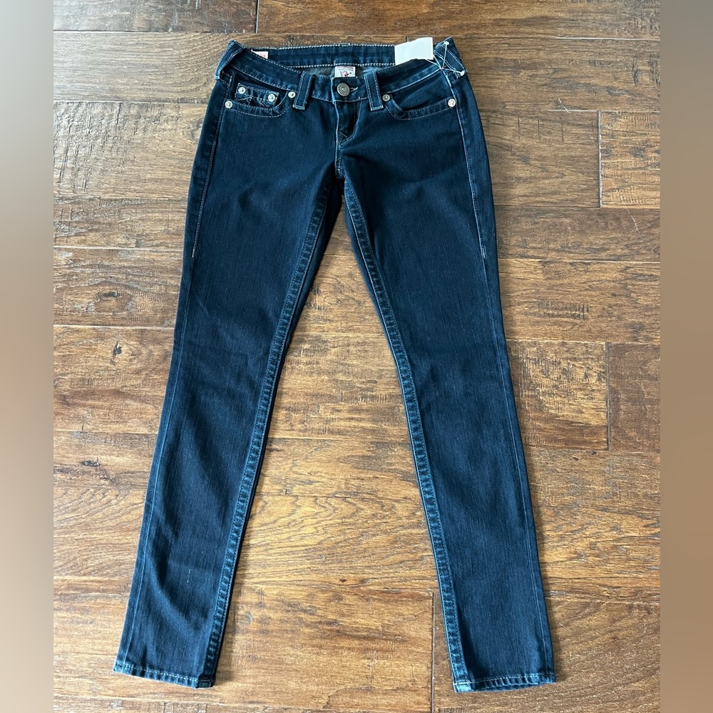 Dark wash, lower rise True religion jeans.